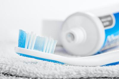 tooth brush next to an open toothpaste, Garran ACT