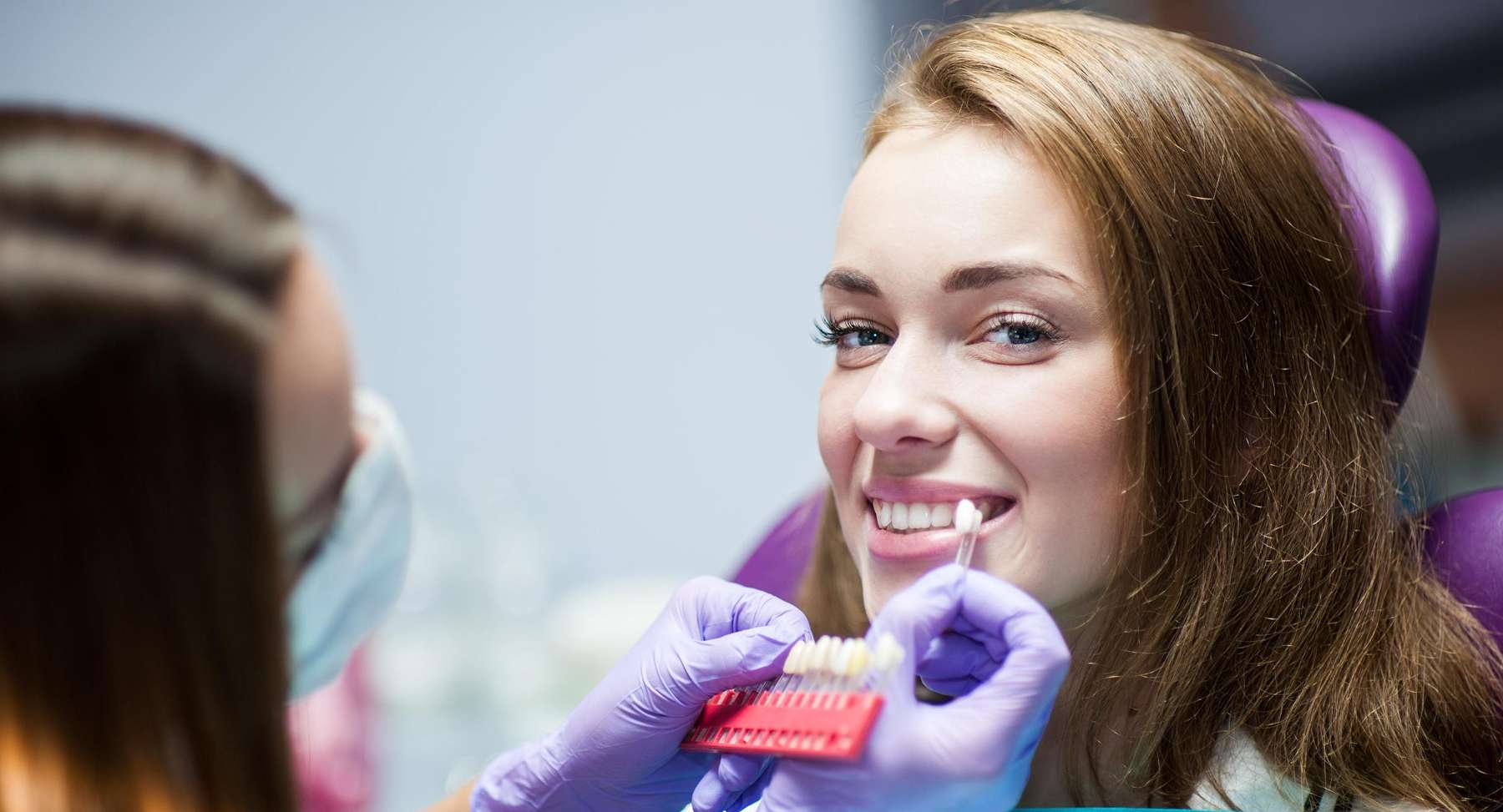 woman smiling during dental exam