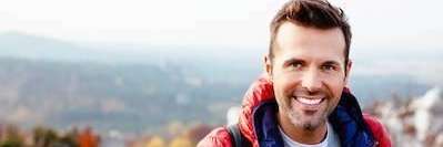 Middle aged man smiling after learning how to maintain his oral health, Garran ACT